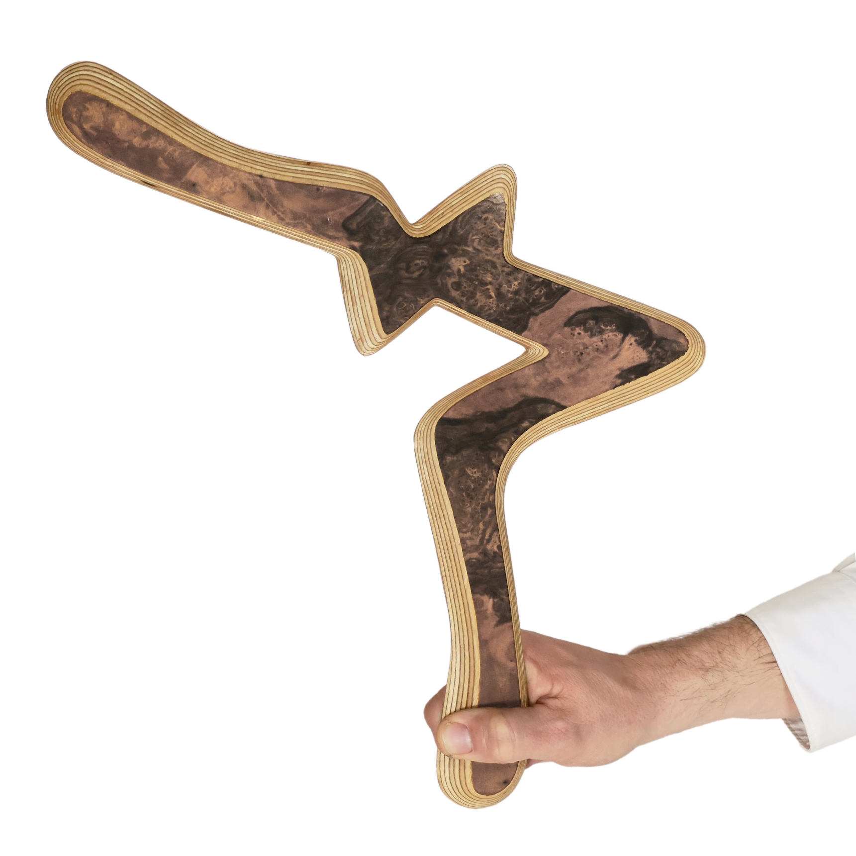 Image of Alva Size Comparison, Hand holding decorative burl wood boomerang with green and amber tones against navy blue backdrop