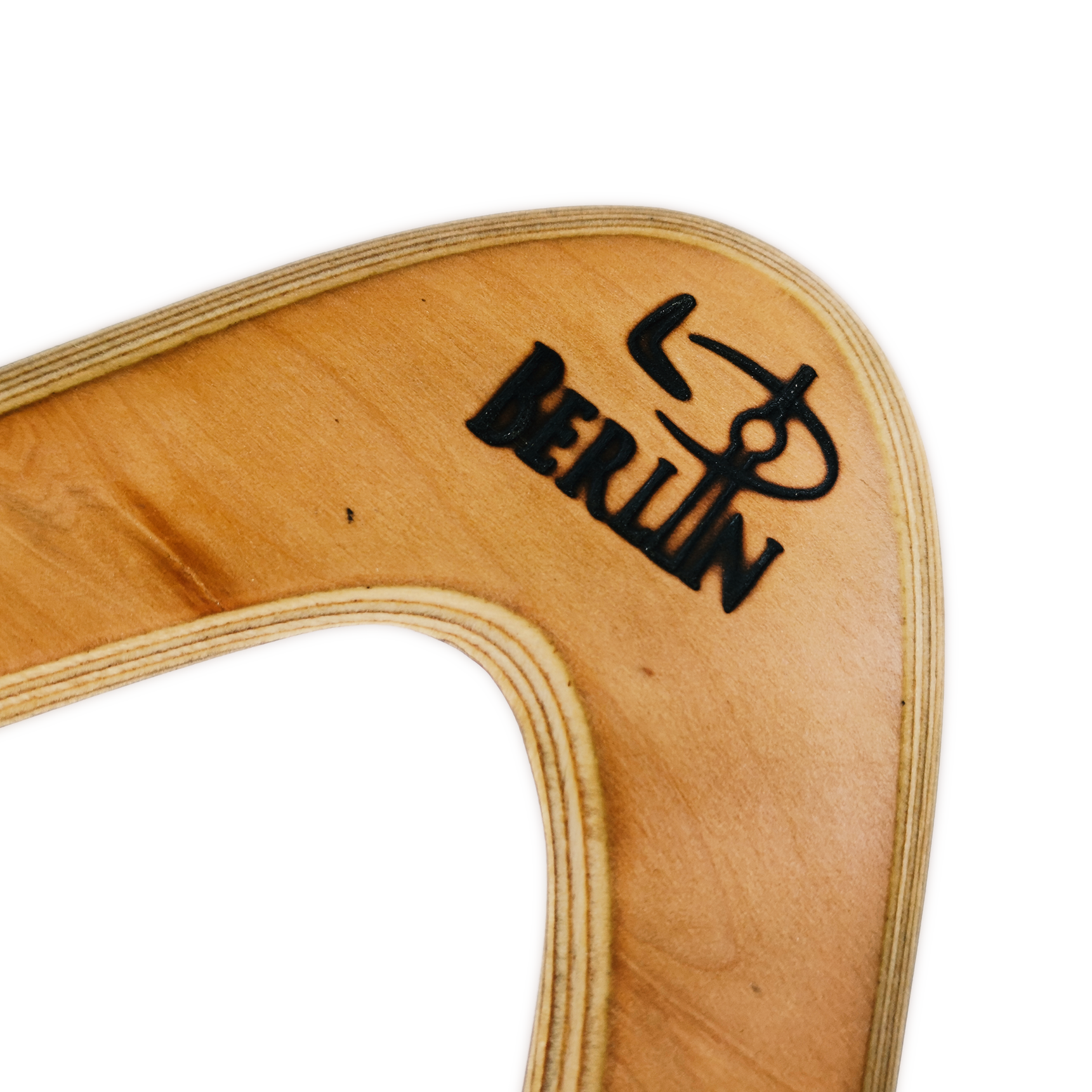 Image of Berliner Boomerang Close-up  with  "Berliner" logo branded on natural maple wood boomerang elbow