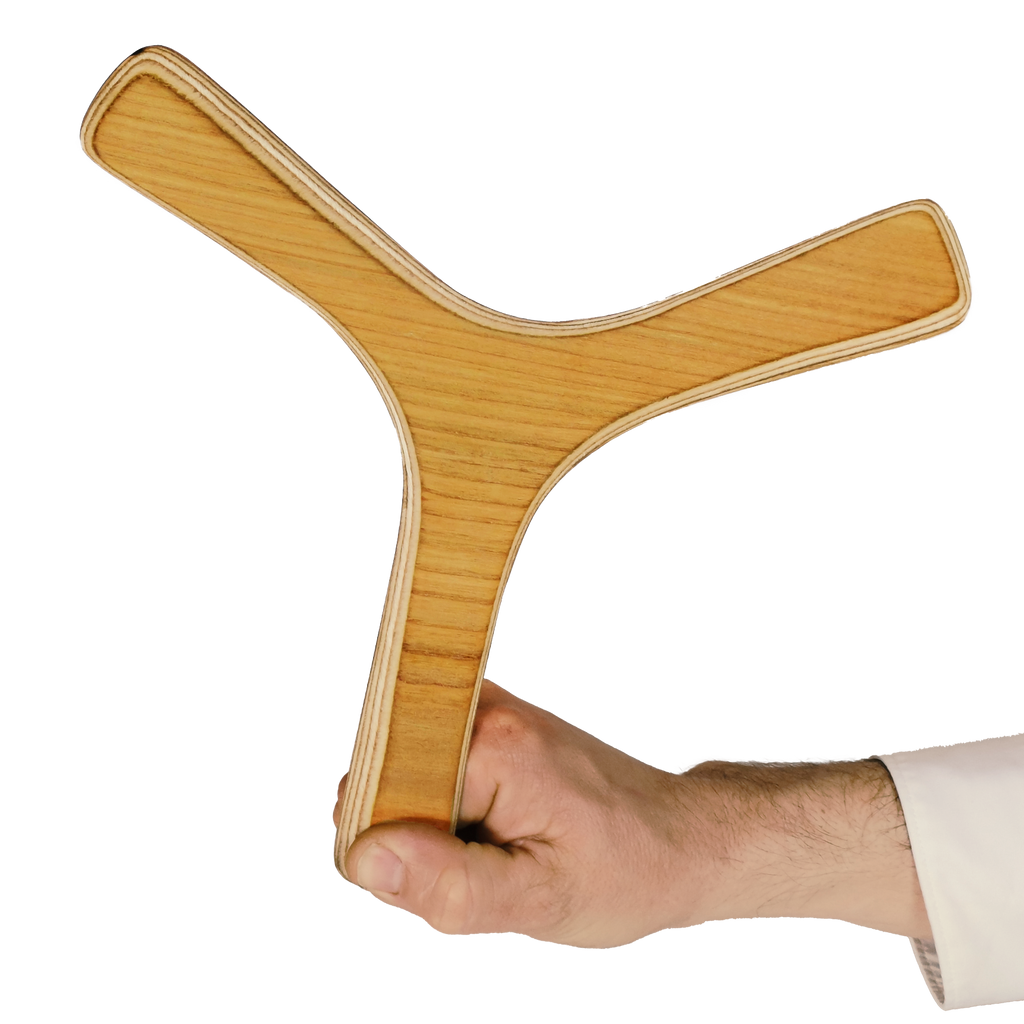 Image of Cloud Catcher Boomerang size comparison shot, tri-blade boomerang in light ash wood with visible grain patterns