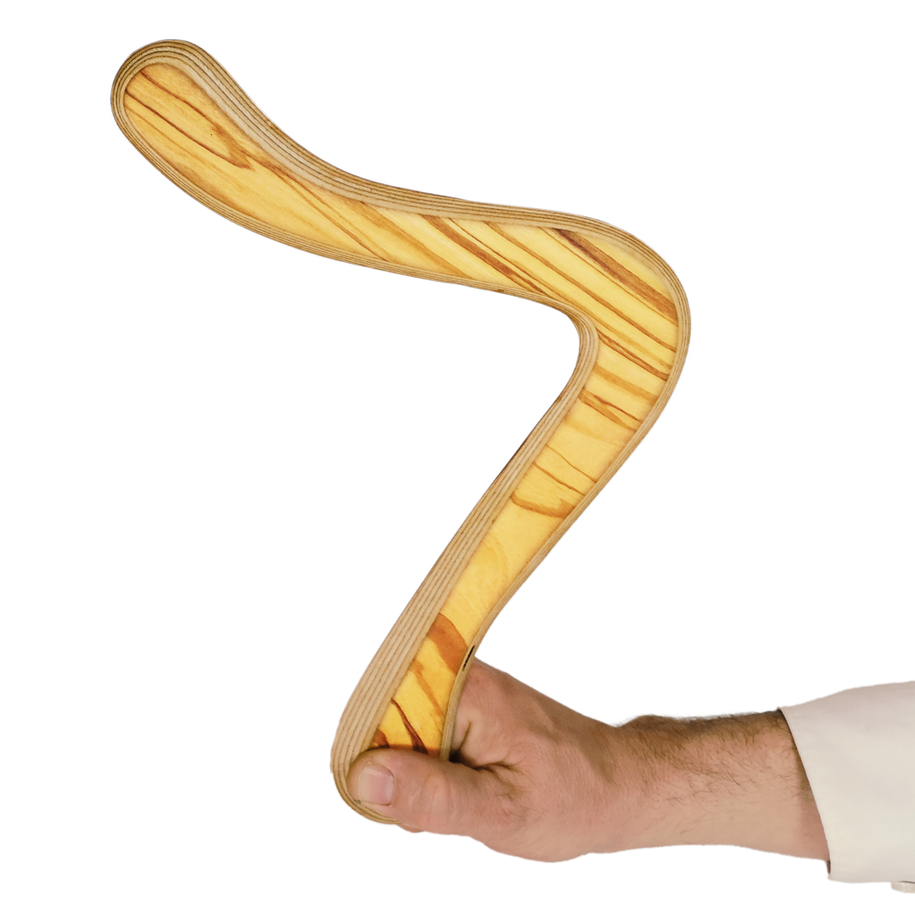 Image of Moilanen Arc size comparison shot , hand demonstrating curved pine wood boomerang with striped grain texture