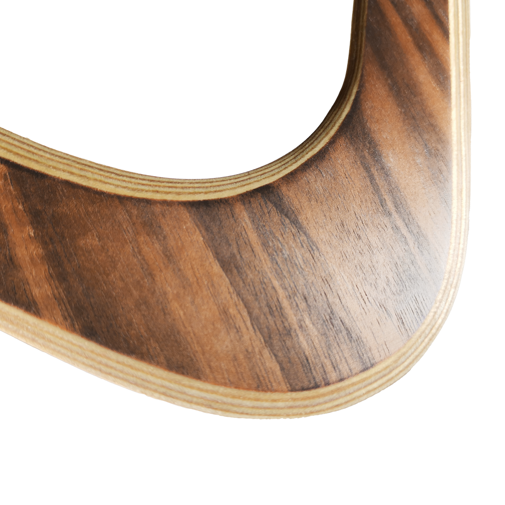 Image of Sky Scraper Close-up of walnut boomerang inner curve with visible wood grain and smooth finish