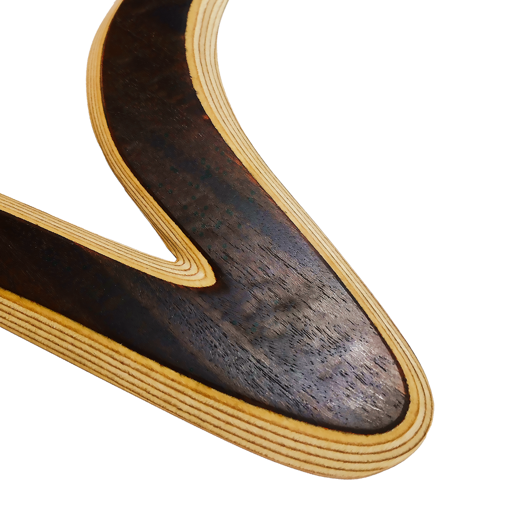 Image of Venezia Boomerang  close-up shot  showing Detailed view of ebony boomerang curve with fine black wood texture