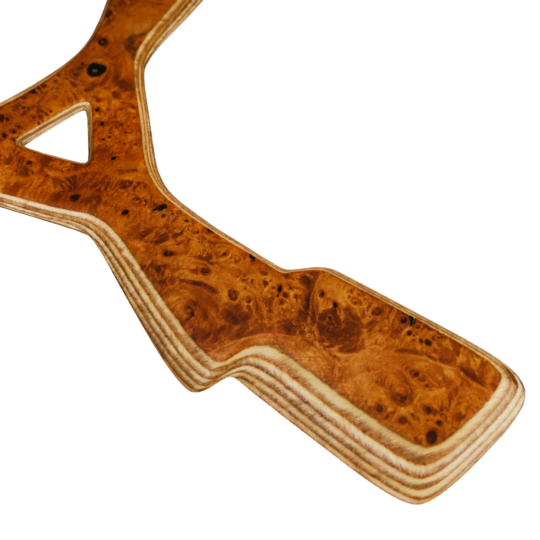 Image of Zeus Close-up with Karelian birch burl boomerang center showing distinctive bird's eye grain and triangular cutout